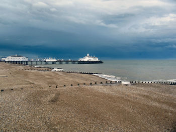 Eastbourne pier against cloudy sky