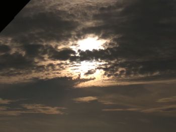 Silhouette of birds against sky during sunset