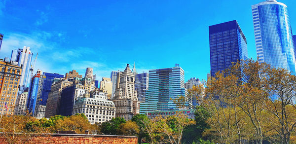 Low angle view of buildings against blue sky