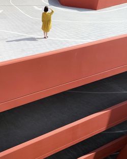 High angle view of woman standing on street