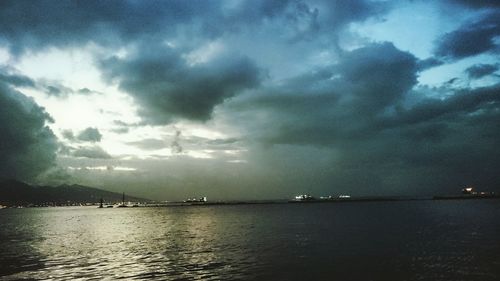 Scenic view of sea against cloudy sky