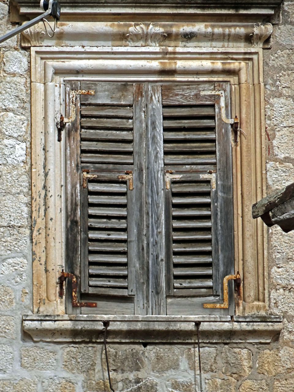 CLOSED WOODEN DOOR OF WINDOW