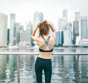 Rear view of woman looking at cityscape