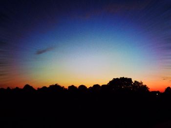 Silhouette of trees at sunset