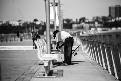 View of a man preparing to fish