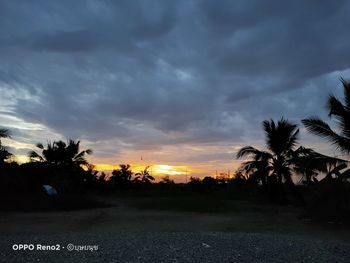 Scenic view of silhouette palm trees against sky during sunset