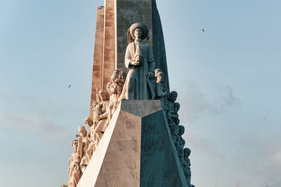 Low angle view of statue against sky