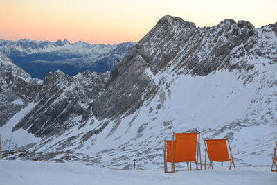 Snow covered landscape against sky