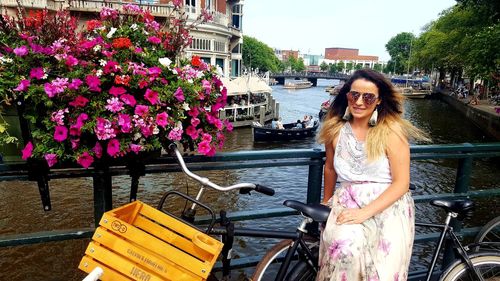 Portrait of smiling young woman on bicycle