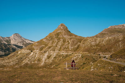 Scenic view of mountains against clear blue sky