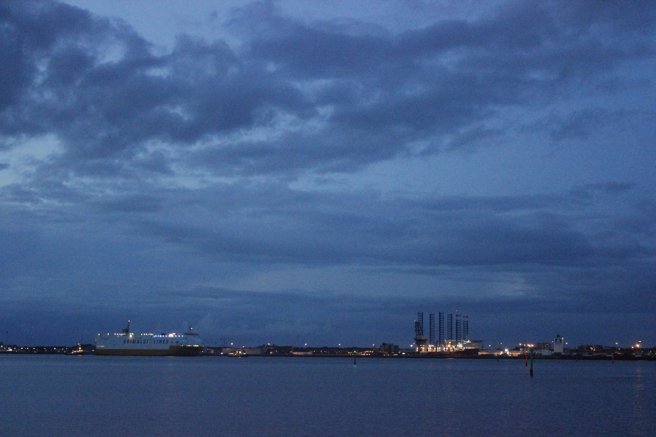 SCENIC VIEW OF SEA BY CITY AGAINST SKY