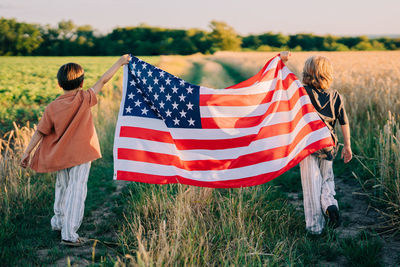 Low angle view of american flag on field