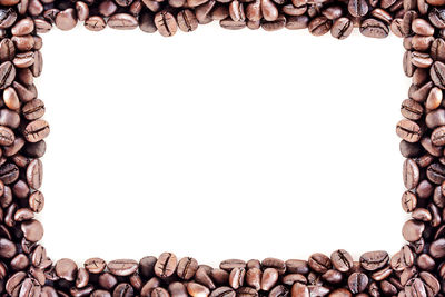 Directly above shot of coffee beans against white background