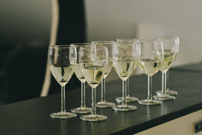 Close-up of wine glasses on table