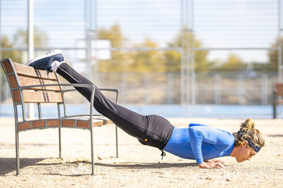 Side view of man lying on floor