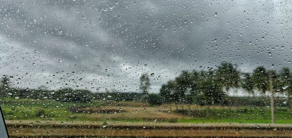 Raindrops on glass window during rainy season