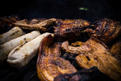 High angle view of meat on barbecue