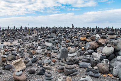 Rocks on beach against sky