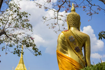 Low angle view of statue against sky