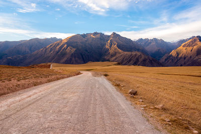 Road by mountain against sky at sacred valley