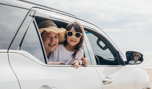 Portrait of young woman in car