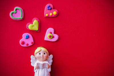 Close-up of stuffed toy against red background