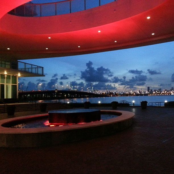 illuminated, night, architecture, built structure, sky, transportation, reflection, indoors, dusk, river, water, lighting equipment, city, blue, travel, building exterior, no people, nautical vessel, red, arts culture and entertainment