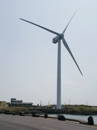 Wind turbine against sky