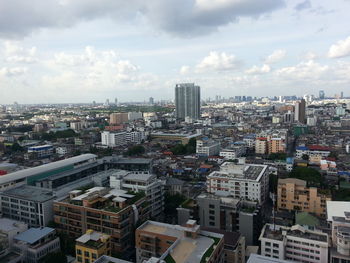 High angle view of buildings in city against sky