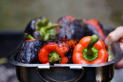 Close-up of red chili peppers on barbecue grill