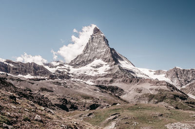 Scenic view of snowcapped mountains against sky