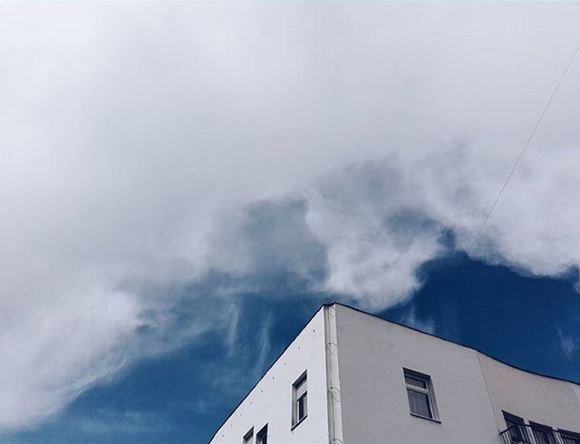 building exterior, architecture, built structure, sky, low angle view, high section, cloud - sky, residential structure, house, residential building, cloudy, building, weather, city, overcast, outdoors, cloud, day, no people, roof