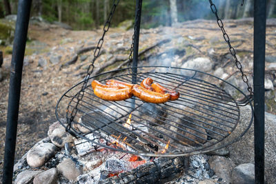 High angle view of meat on barbecue grill