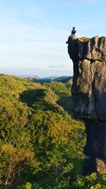 Scenic view of rocks on landscape against sky
