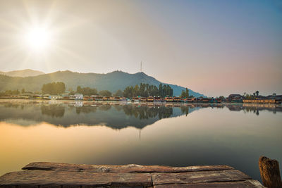 Scenic view of lake against sky during sunset