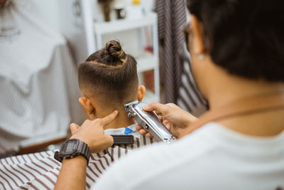 Close-up of man using mobile phone