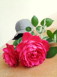 Close-up of red roses on table