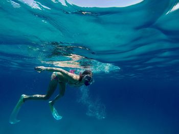 High angle view of person swimming underwater