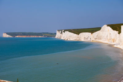 Scenic view of sea against clear blue sky