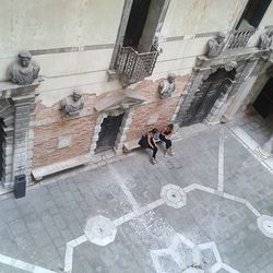 Woman standing in front of building