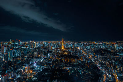 High angle view of city lit up at night