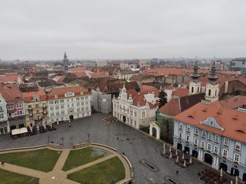 High angle view of buildings in city against sky