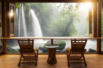 Chairs and tables against window