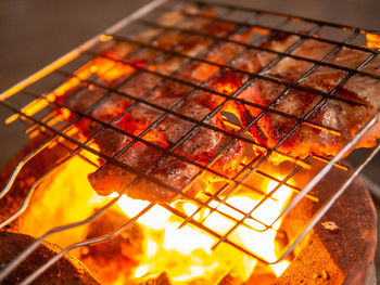 Close-up of meat on barbecue grill