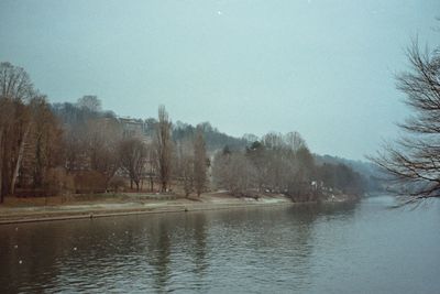 Scenic view of lake against sky during winter