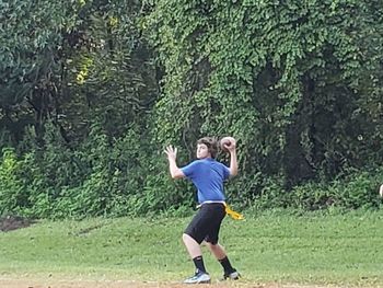 Full length of a young man in the forest