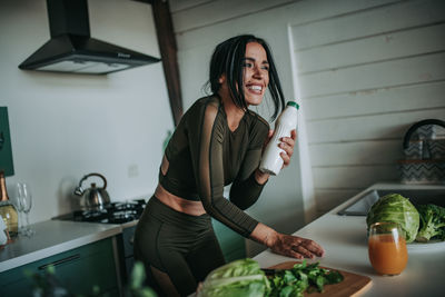 Woman holding food at home