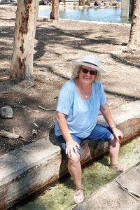 Portrait of a woman  sitting on stone 