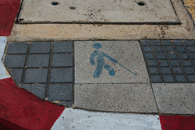 High angle view of arrow sign on road