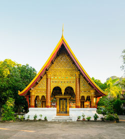 Facade of temple against building